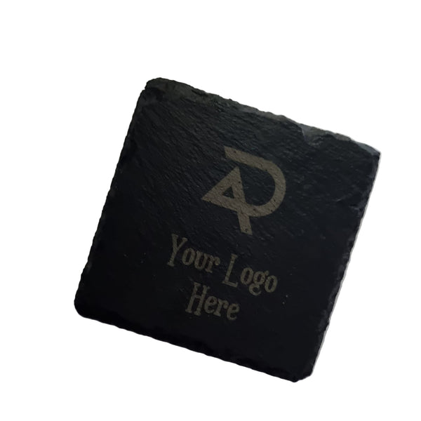 Black slate coaster with engraved logo and text on a white background